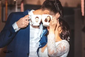 Hand-painted wedding mugs with portraits of the newlyweds