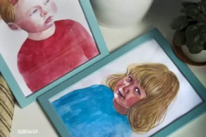 A realistic portrait painted in watercolour - a little girl