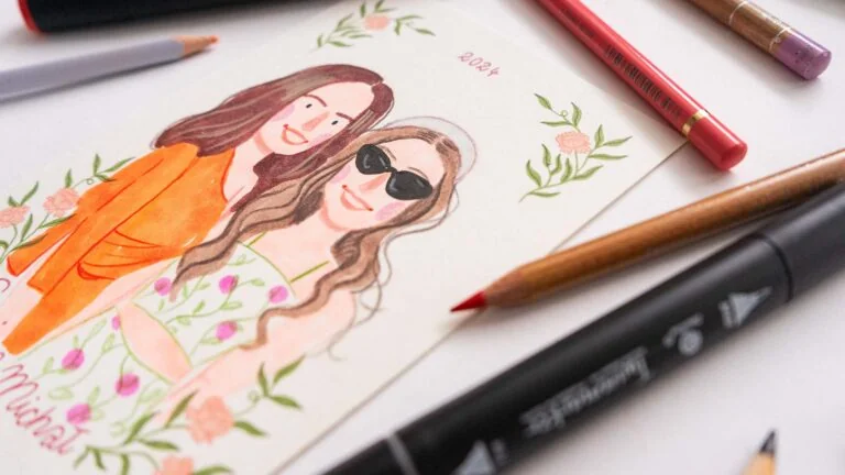 Akwarelowy ilustrowany portret dwóch kobiet z kwiatowym motywem, obok kredki i marker